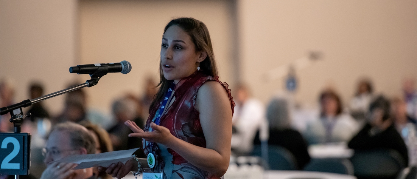 Woman speaking into a microphone at CHF Canada AGM 2018