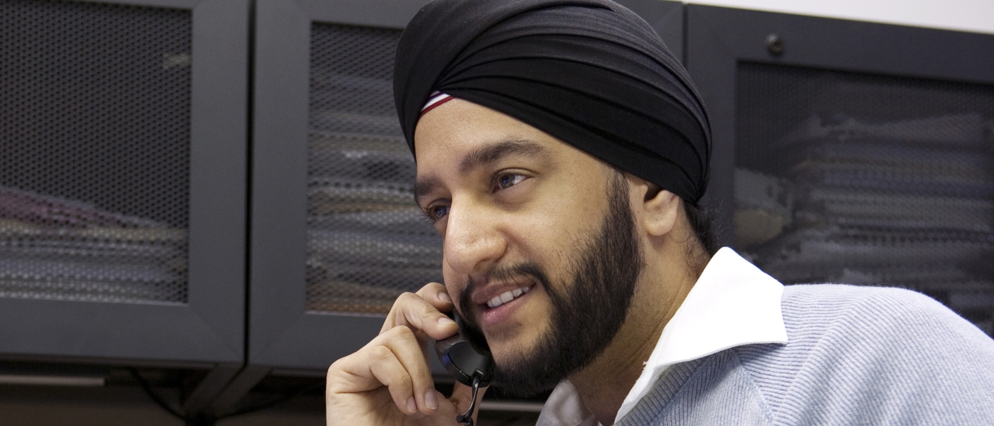 Sandeep Thethy on a telephone call in an office