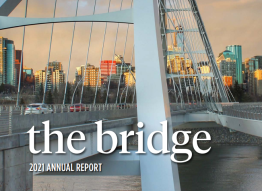 Photo of a bridge spanning a river with text that reads The Bridge 2021 Annual Report